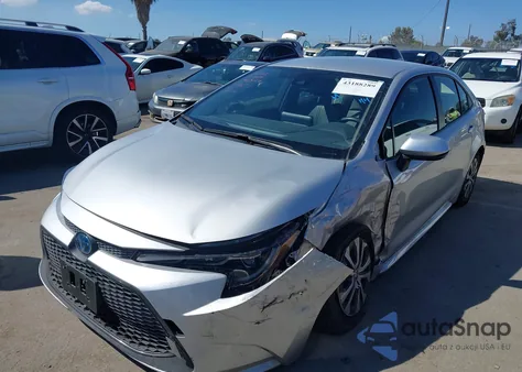 2022 Toyota Corolla Hybrid Le z USA, uszkodzony, nr VIN JTDEAMDE8NJ051697